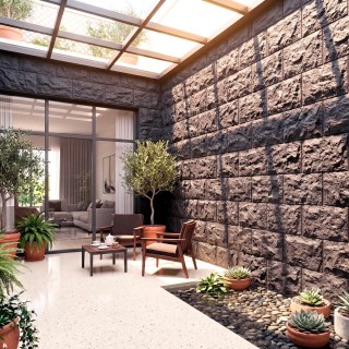 Revestimiento gris con efecto piedra para exterior moderno